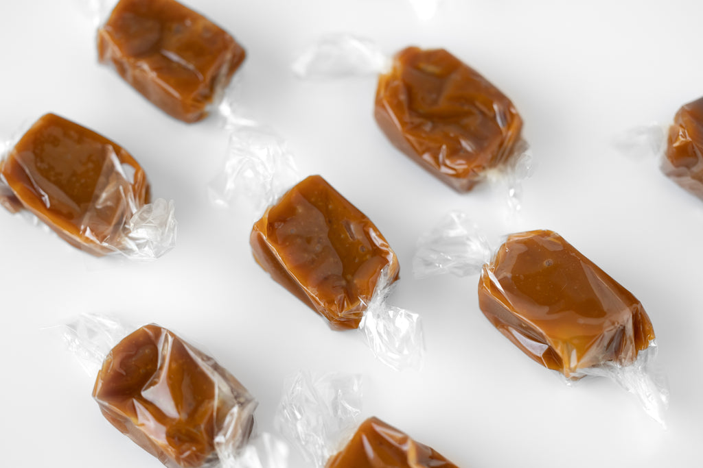 Handcrafted Salted Caramels – Soft, chewy, and buttery caramels made without corn syrup. Small-batch, rich with real butter and topped with flaky sea salt from England for the perfect sweet-salty balance.