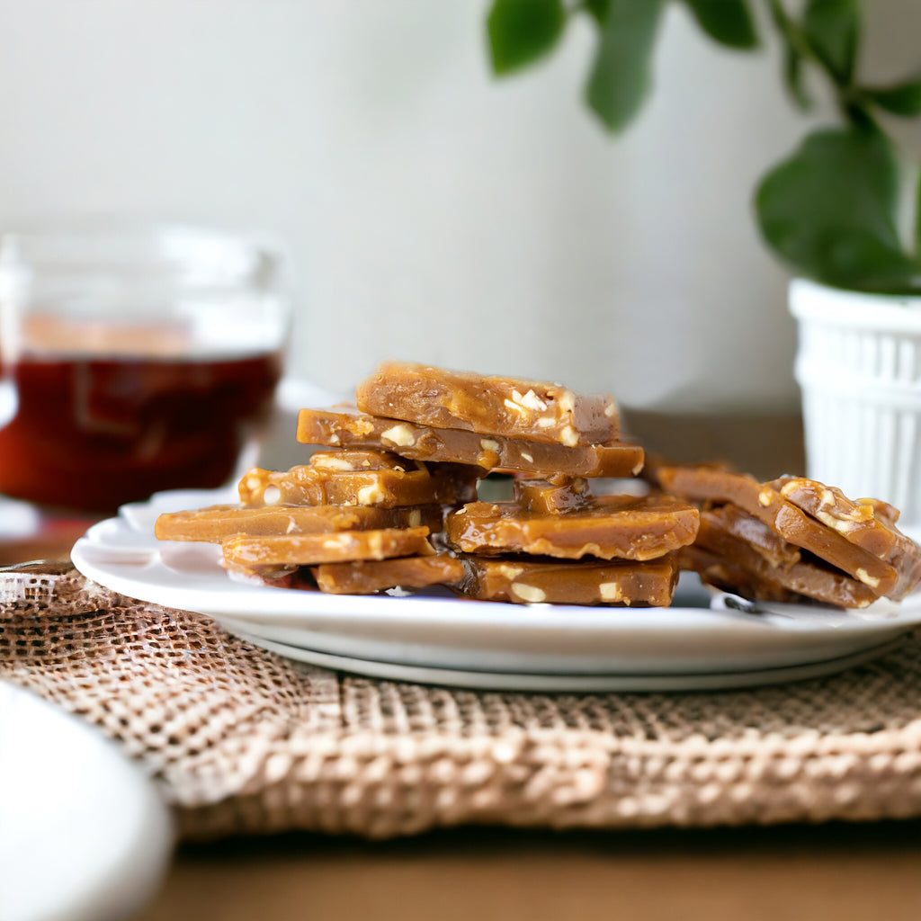 Uncoated English Toffee with Almonds – Handcrafted, buttery, and crunchy toffee made in small batches with real butter, pure cane sugar, and roasted almonds. No corn syrup or preservatives.